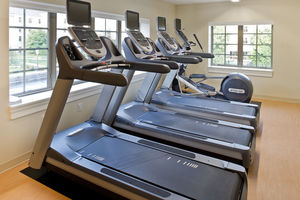 Morris Inn Cardio Room - Treadmills and an elliptical fill the room.